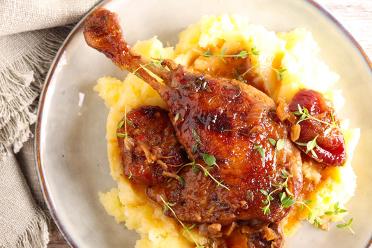 Roasted non-GMO pastured duck leg on top of mash 