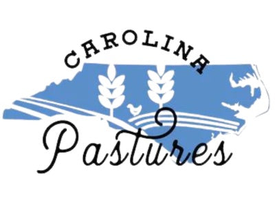 Logo of Carolina Pastures, with a blue outline of North Carolina and wheat stalks representing our pasture-raised non-GMO meats