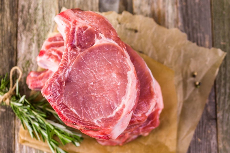 Raw non-GMO forest-raised pork chop from carolina pastures