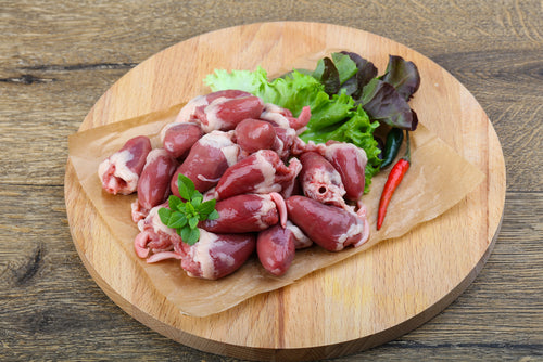 pasture raised duck or chicken hearts on a cutting board, non-GMO and raised by Carolina Pastures in Hurdle Mills, NC